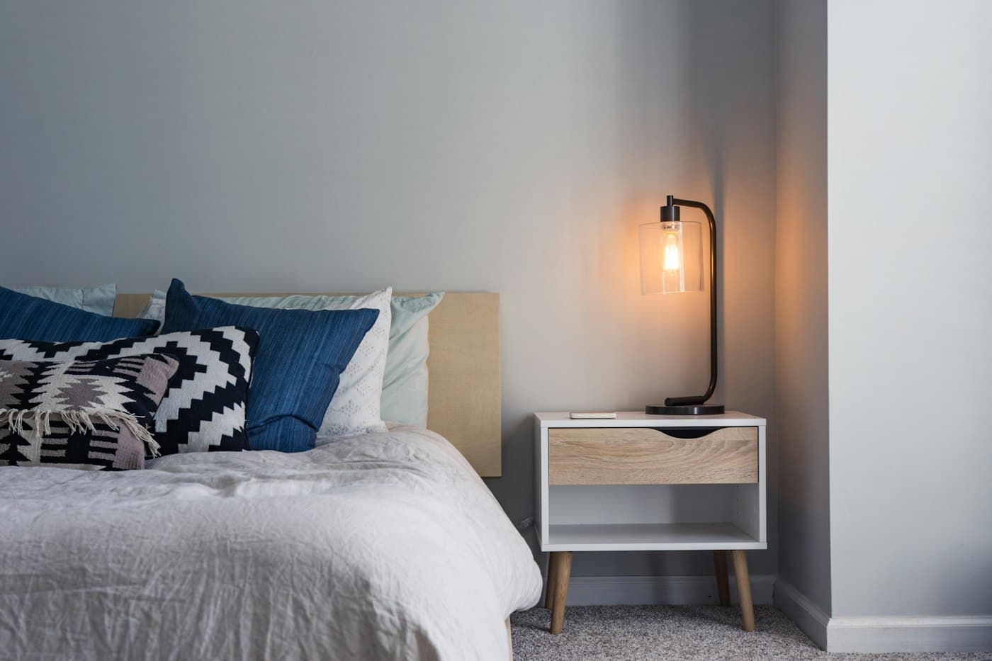 A quiet, linen-dressed room prepared for rest.